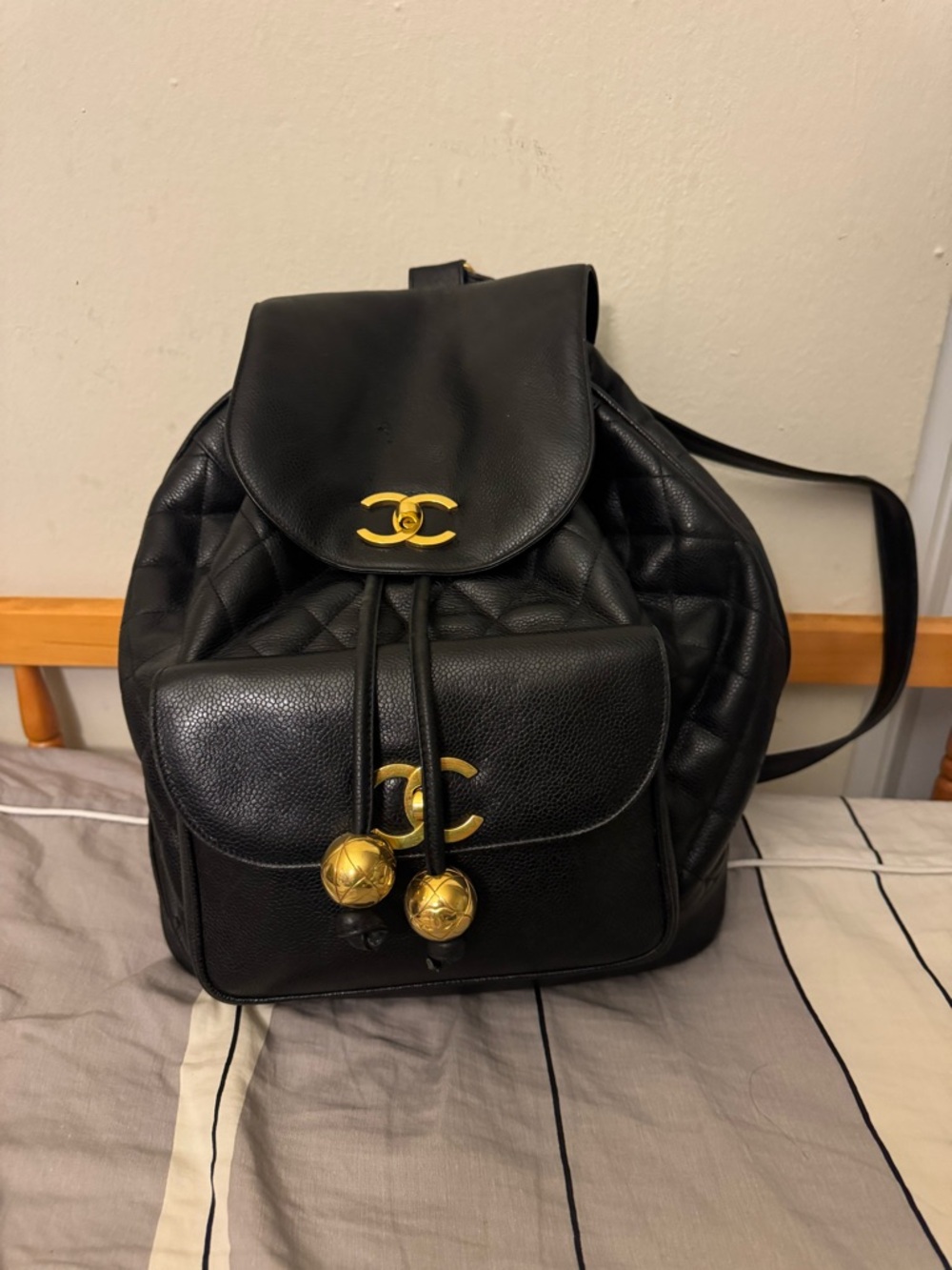 CHANEL Black Quilted caviar Leather Backpack with Gold CC Accents